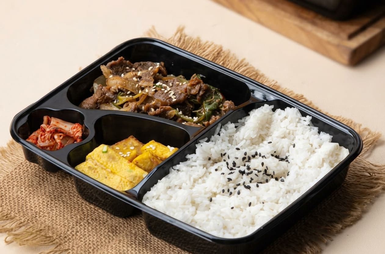Korean dosirak lunch box with rice and assorted side dishes